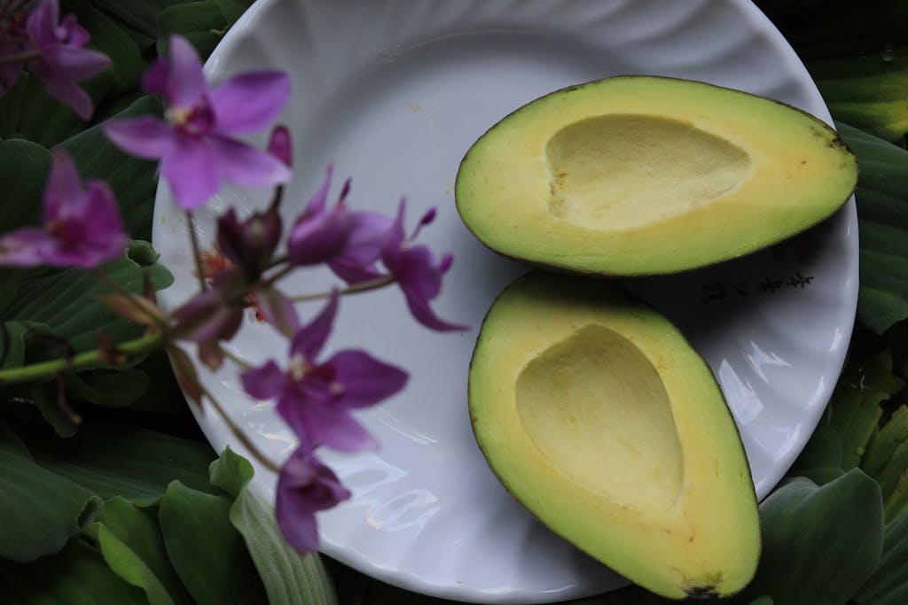 Sliced Avocado on White Ceramic Plate